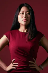 High-contrast portrait of Miyabi in a burgundy red dress at JG Studio in Tokyo.